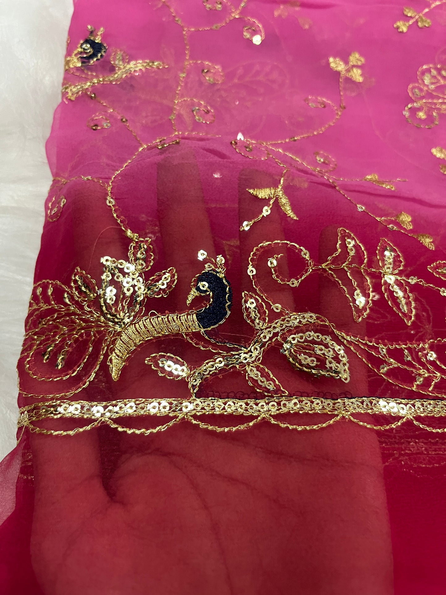 red and baby pink mor jaal saree